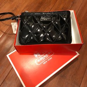New, still in original box black Coach wristlet